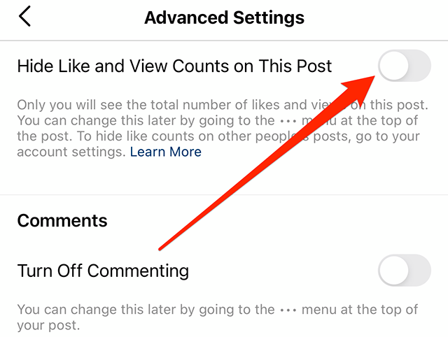 Screenshot of Instagram's "Advanced Settings" screen with a red arrow pointing at the toggle to the right of "Hide Like and View Counts on This Post"