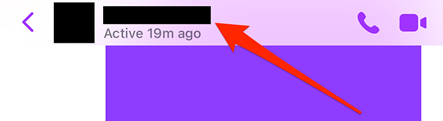 Screenshot of a Messenger From Facebook conversation with a red arrow pointing at the conversation name at the top of the screen