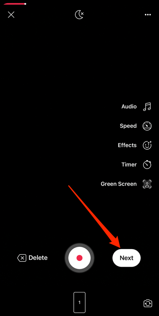 Screenshot of the Facebook Reels camera with a red arrow pointing at the "Next" button near the bottom-right corner of the screen