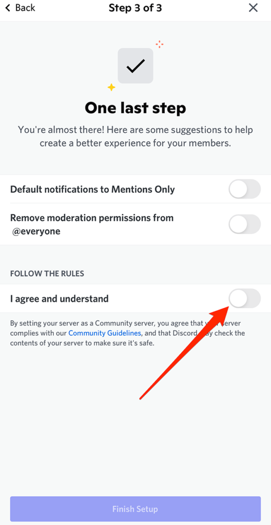 Screenshot of Discord's "One last step" screen with a red arrow pointing at the gray toggle to the right of "I agree and understand"