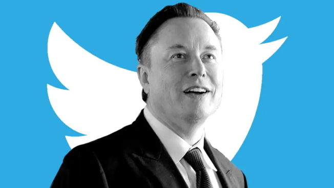 elon musk in front of the twitter logo