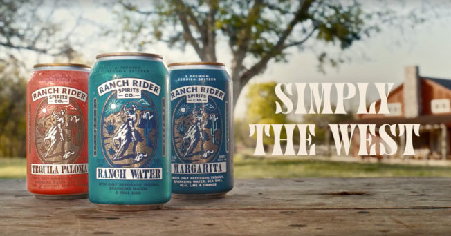 Three cans of Ranch Rider drinks with the slogan Simply the West