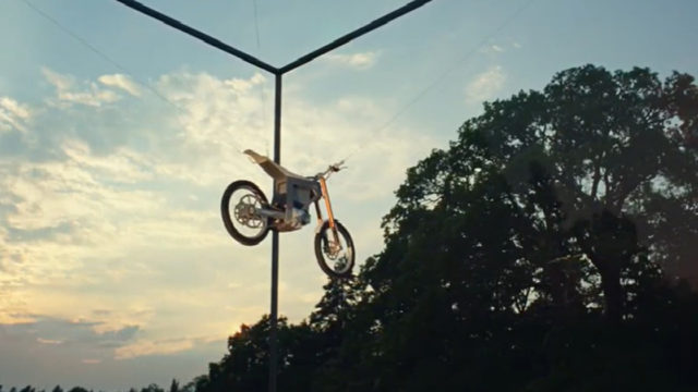 e-Dirt Bike Glass Box Stunt Demonstrates Automaker's Eco Plan