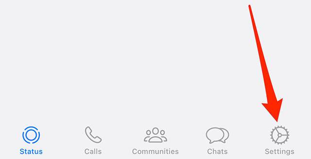 Screenshot of WhatsApp's bottom navigation bar with a red arrow pointing at "Settings"